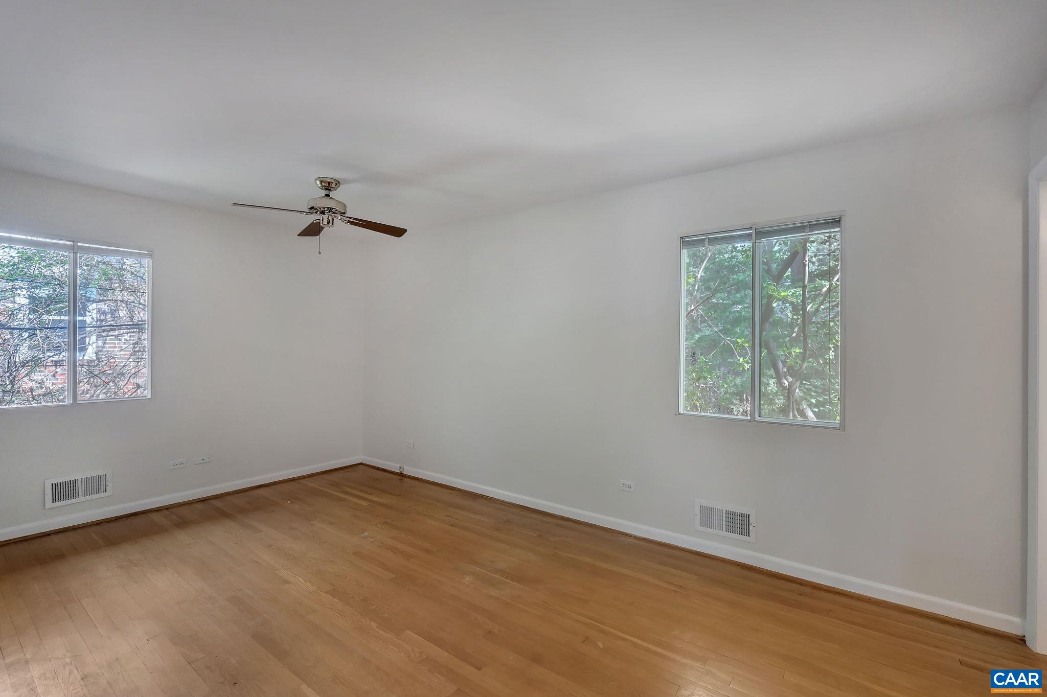 707 Village Road Charlottesville, VA 22903 - Photo 22 of 46 an empty room with a window