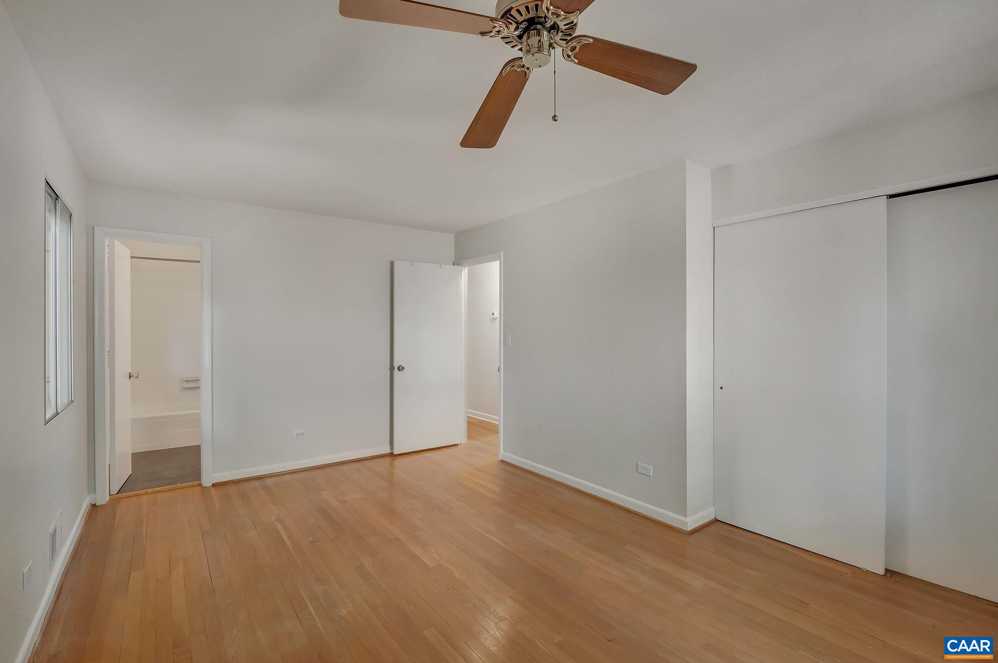 707 Village Road Charlottesville, VA 22903 - Photo 23 of 46 an empty room with closet and fan