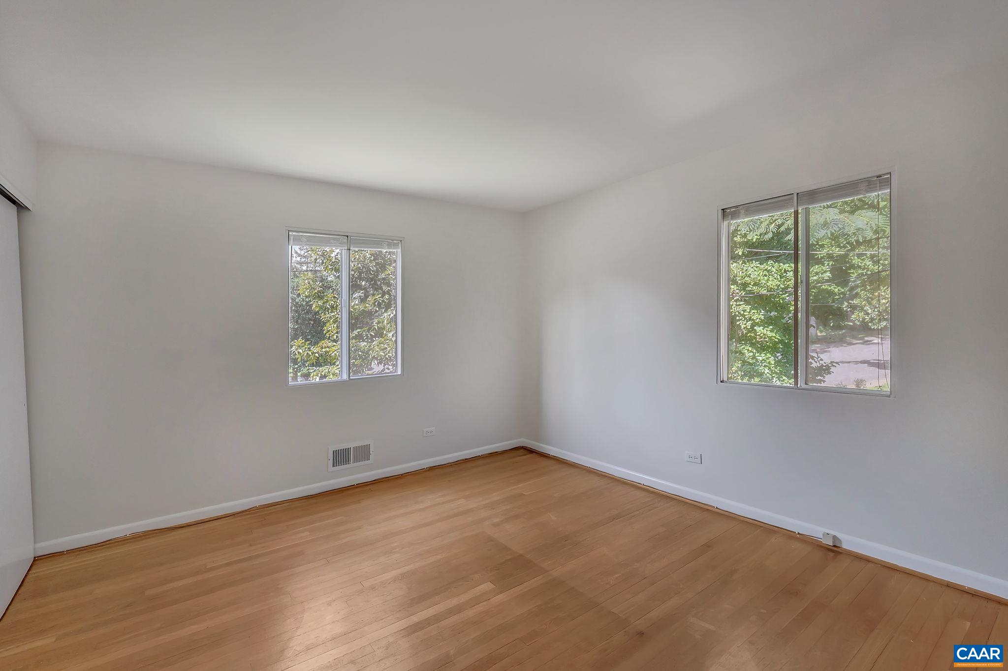 707 Village Road Charlottesville, VA 22903 - Photo 24 of 46 an empty room with a window
