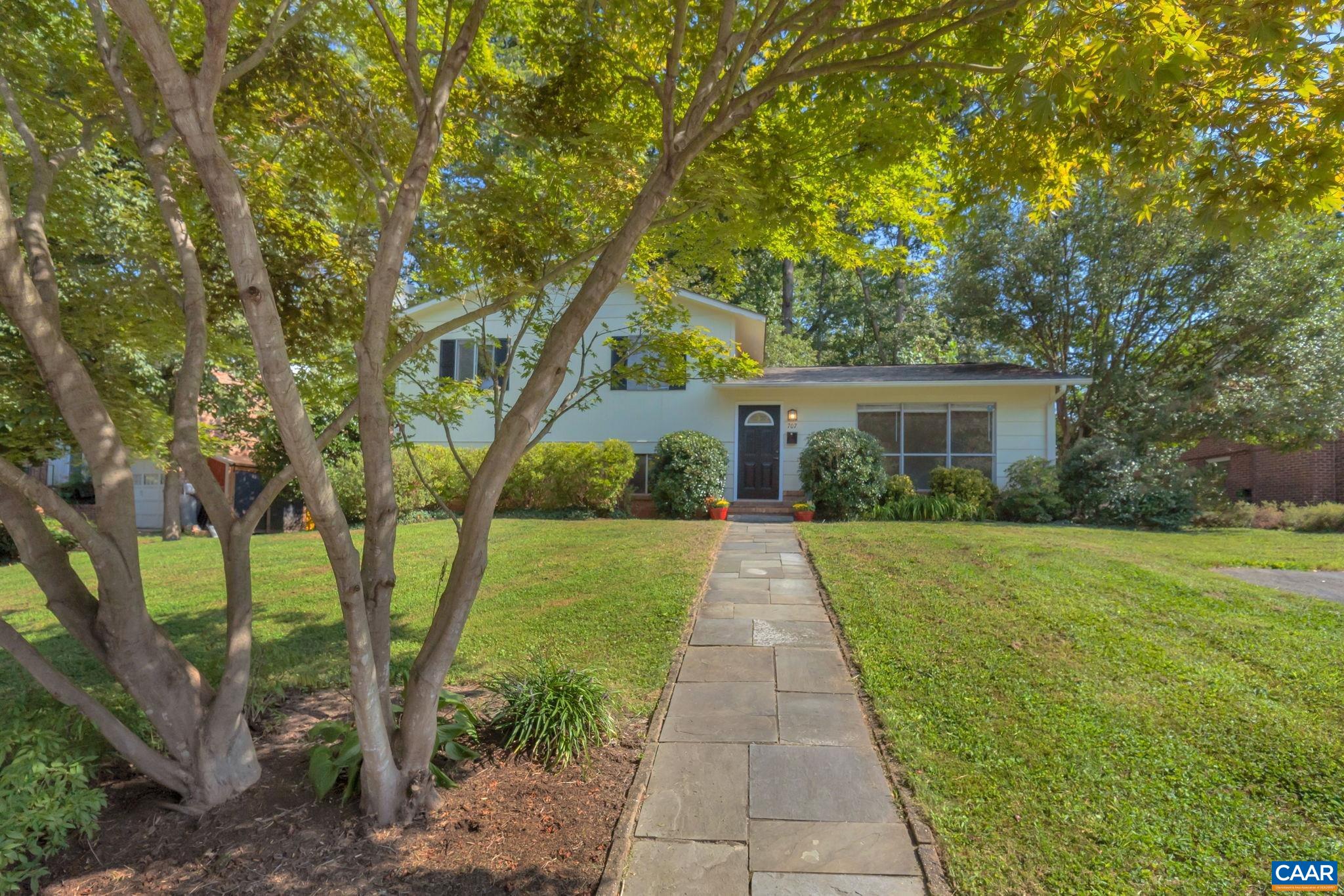 707 Village Road Charlottesville, VA 22903 - Photo 3 of 46 a front view of a house with yard and tree