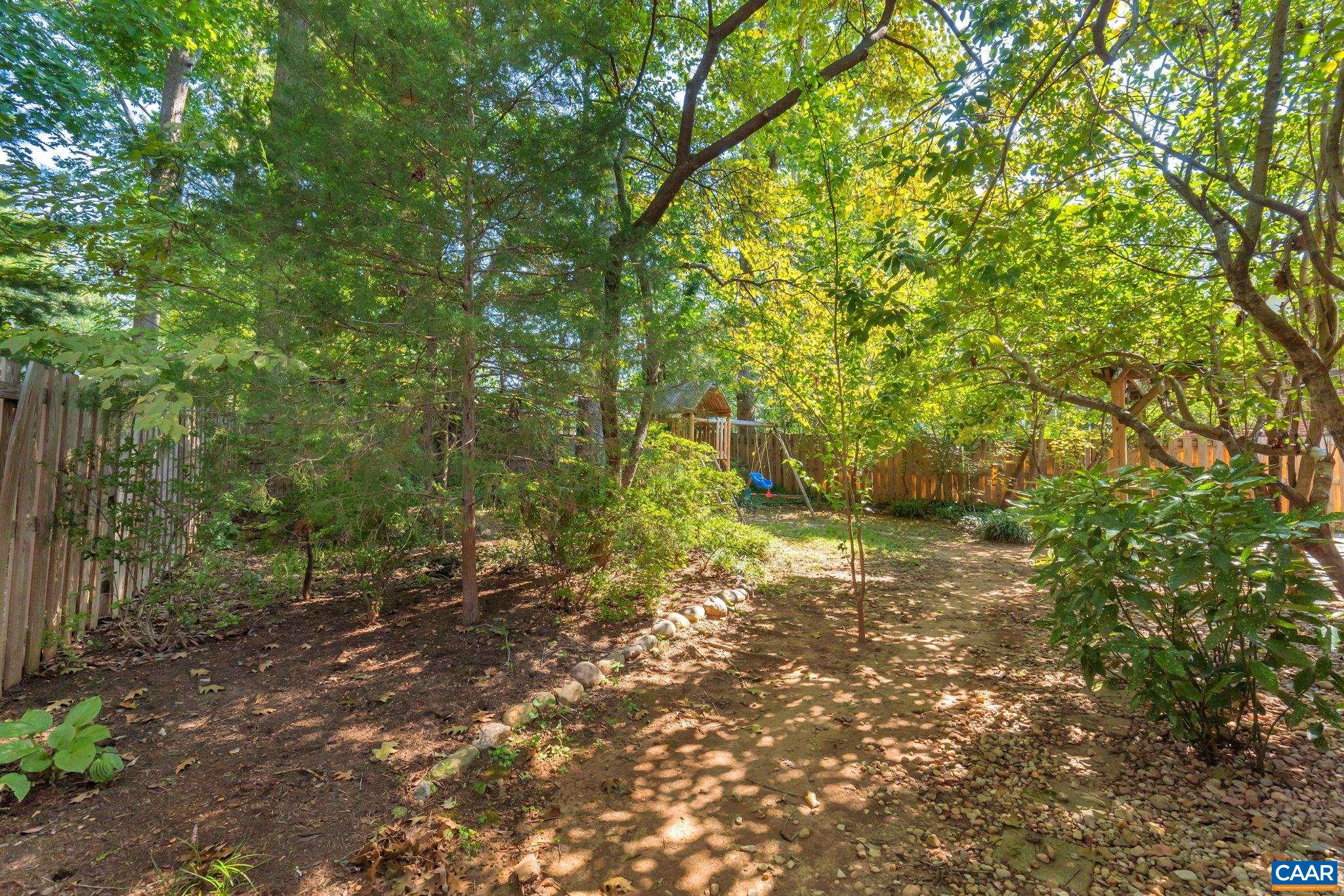 707 Village Road Charlottesville, VA 22903 - Photo 45 of 46 a big yard with lots of green space and house in the back
