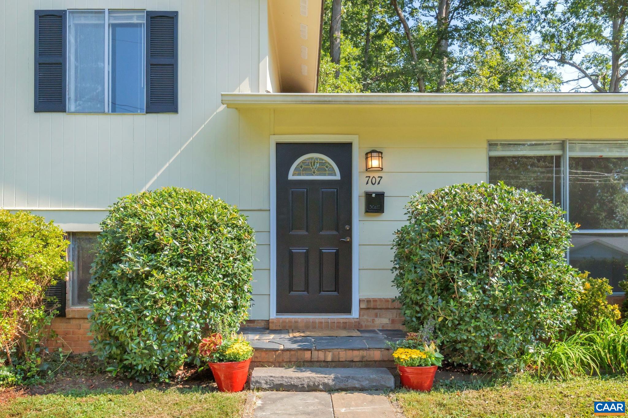 707 Village Road Charlottesville, VA 22903 - Photo 5 of 46 a front view of a house with outdoor space
