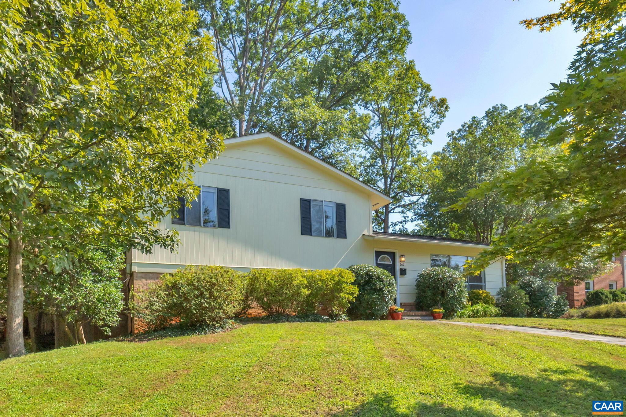 707 Village Road Charlottesville, VA 22903 - Photo 6 of 46 a front view of a house with a yard