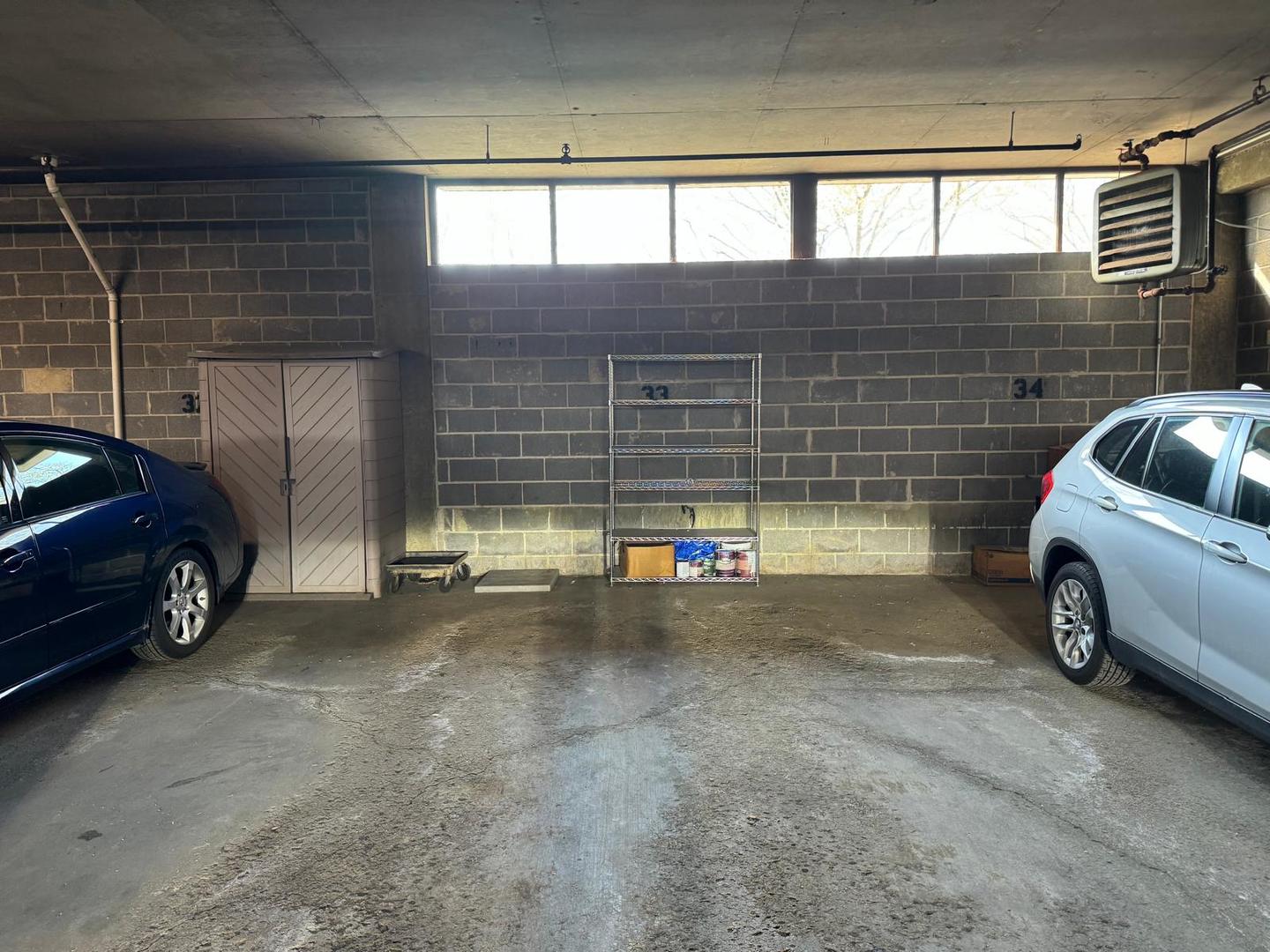 101 Bar Harbour Road, Unit 6A Schaumburg, IL 60193 - Photo 3 of 32 a view of parking garage with cars parked