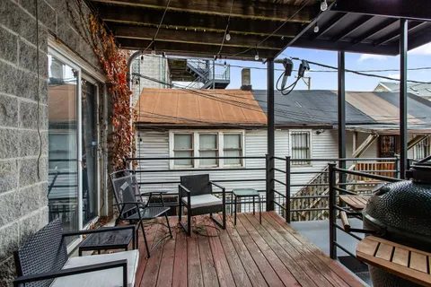 a view of a chairs and table on the deck