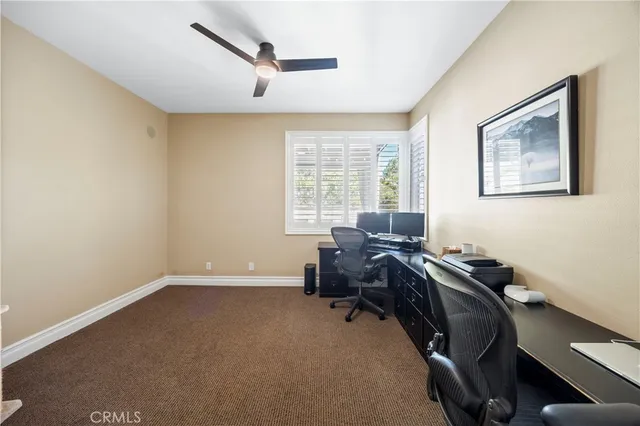 a bedroom with bed and a chandelier