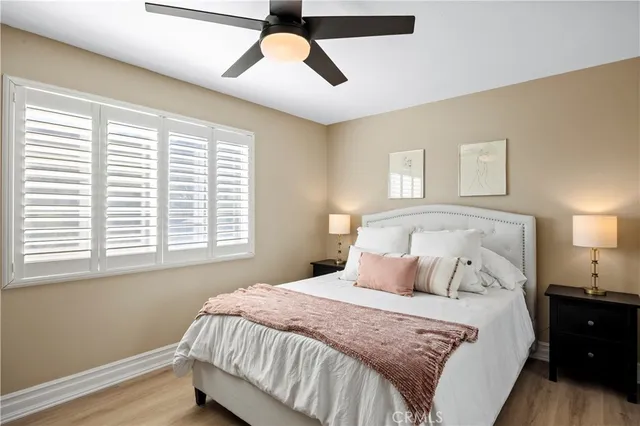 a living room with furniture and a ceiling fan