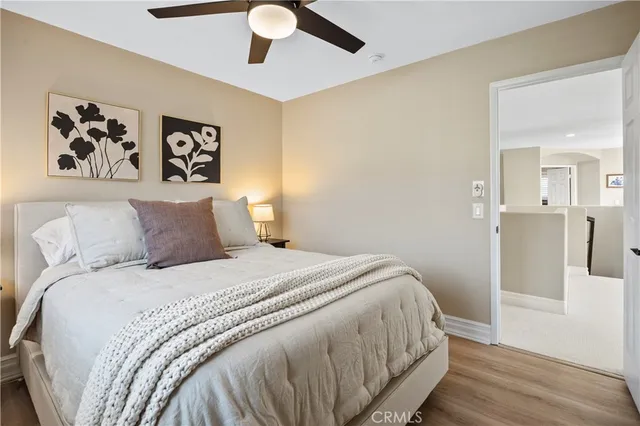 a bathroom with a glass shower door a sink and a mirror