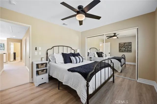a spacious bathroom with a tub sink shower and mirror