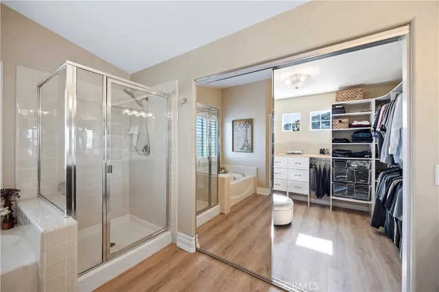 a view of a house with backyard sitting area and garden