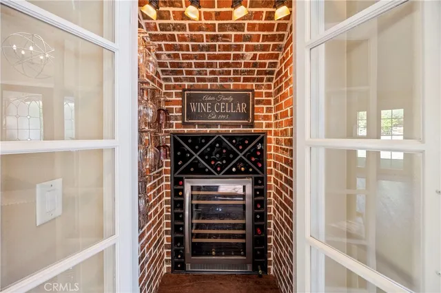 a kitchen with stainless steel appliances granite countertop a refrigerator a stove and a sink