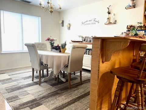 112 Birchwood Road Coram, NY 11727 - Photo 6 of 6 a view of a dining room with furniture and wooden floor