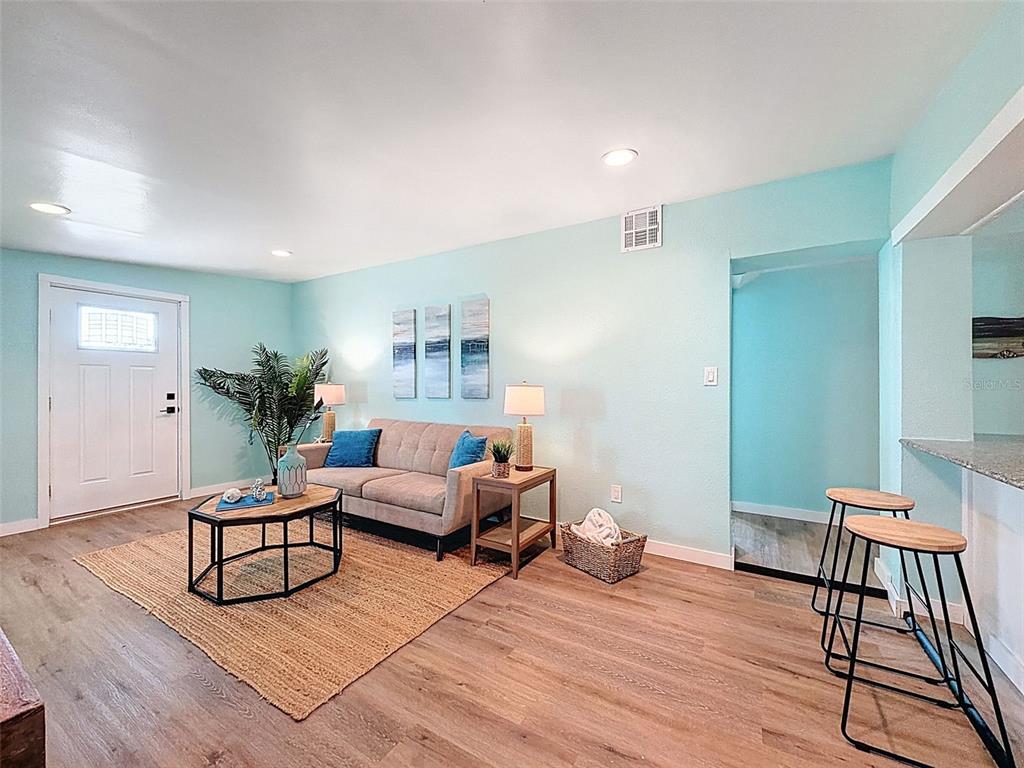 6827 Sanderling Lane Hudson, FL 34667 - Photo 12 of 68 a living room with furniture and wooden floor
