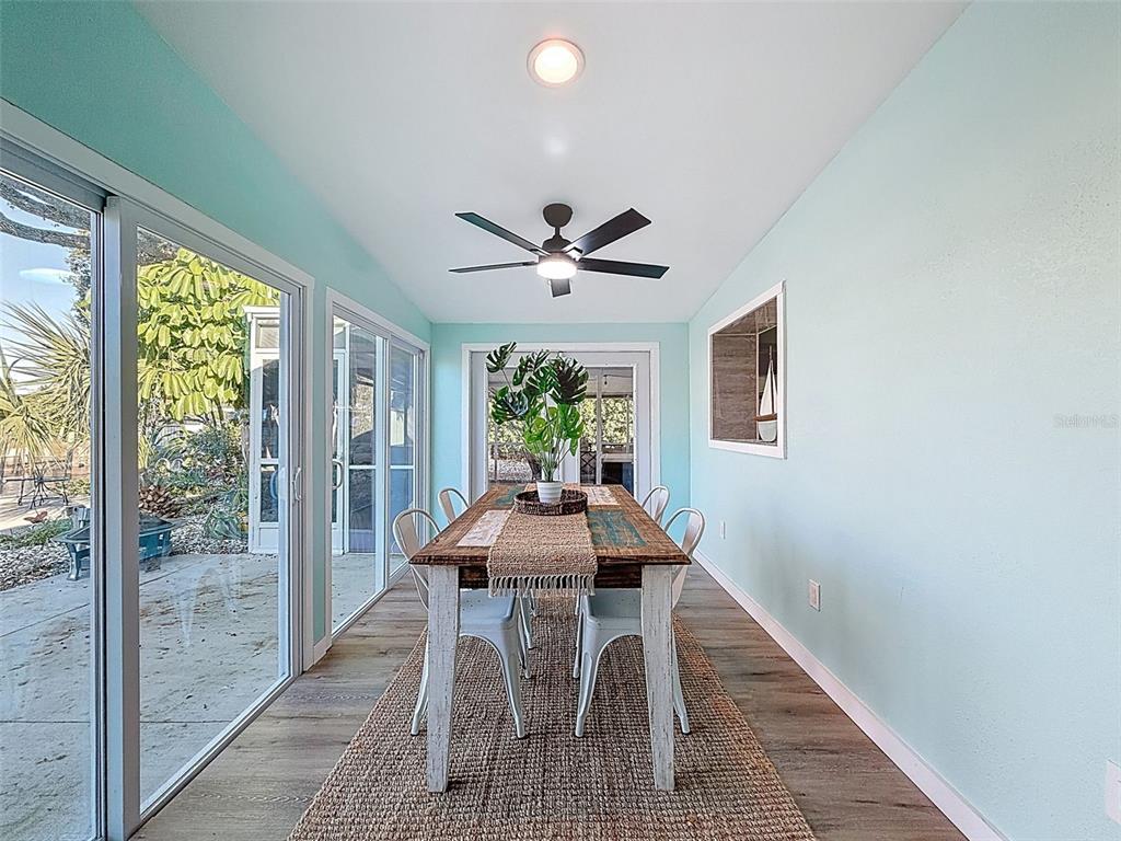 6827 Sanderling Lane Hudson, FL 34667 - Photo 33 of 68 a dining room with furniture and window