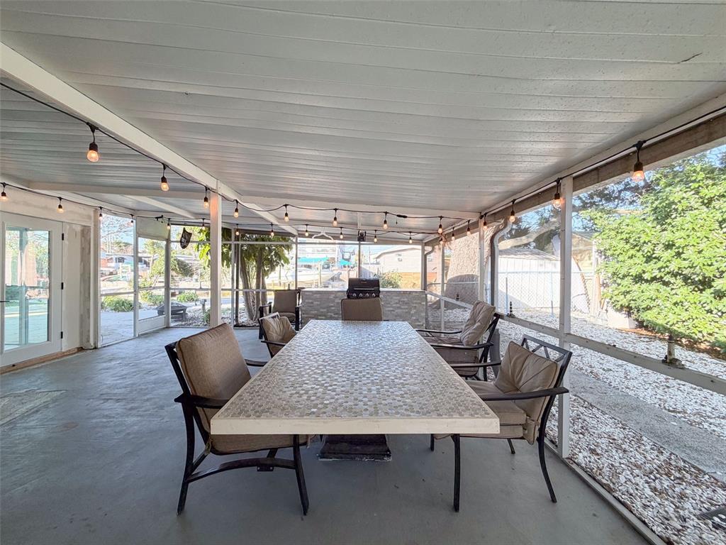 6827 Sanderling Lane Hudson, FL 34667 - Photo 51 of 68 a view of a dining room with furniture window and outside view