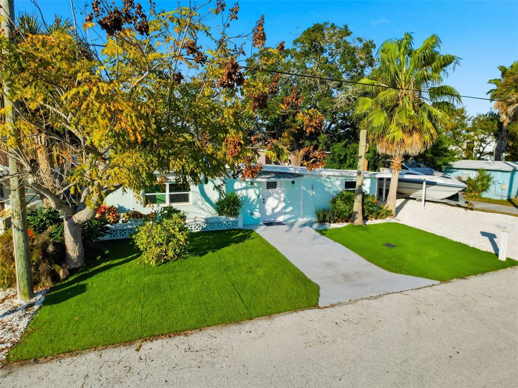 6827 Sanderling Lane Hudson, FL 34667 - Photo 68 of 68 a view of a backyard with a garden