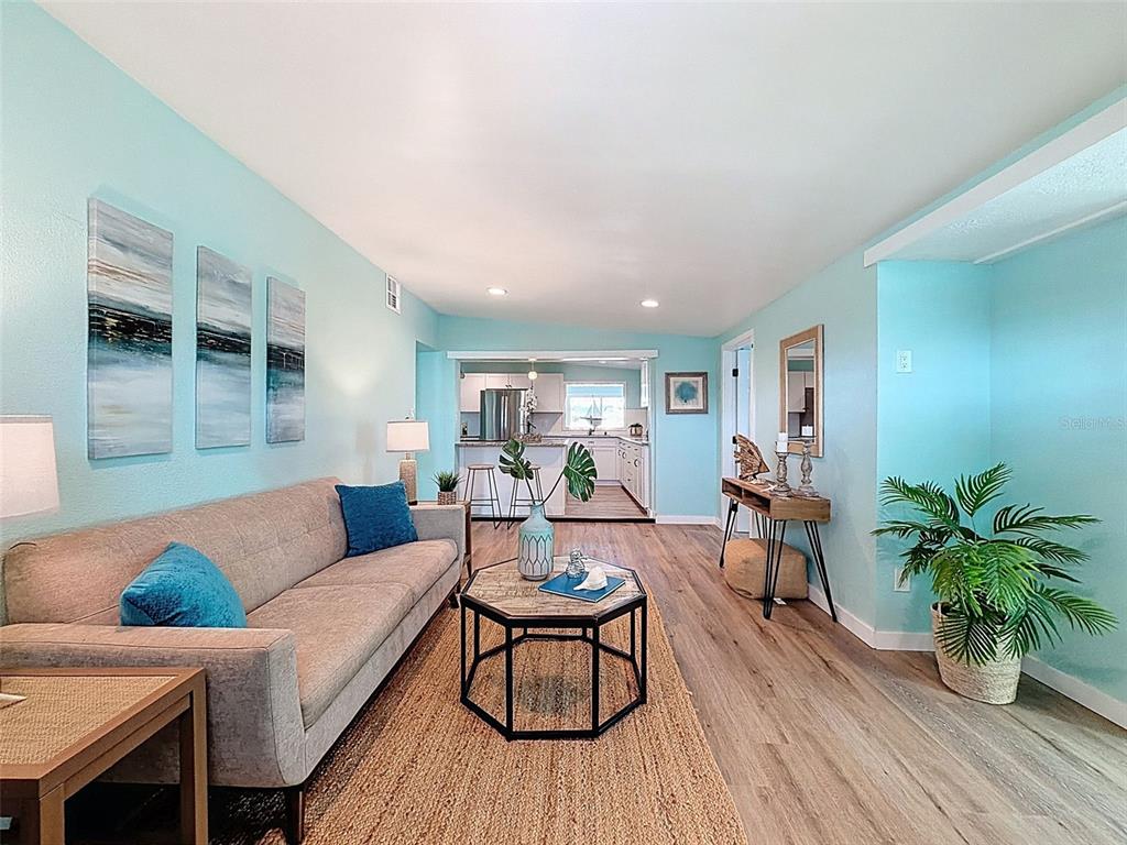 6827 Sanderling Lane Hudson, FL 34667 - Photo 10 of 68 a living room with furniture and a wooden floor