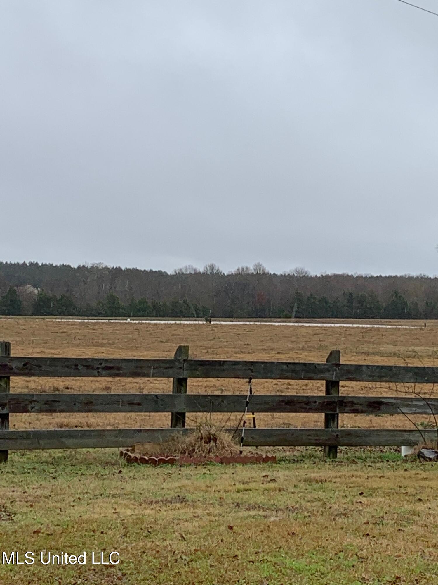 Cane Creek Road Flora, MS 39071 - Photo 2 of 5 Wooden Fence with Small Lake