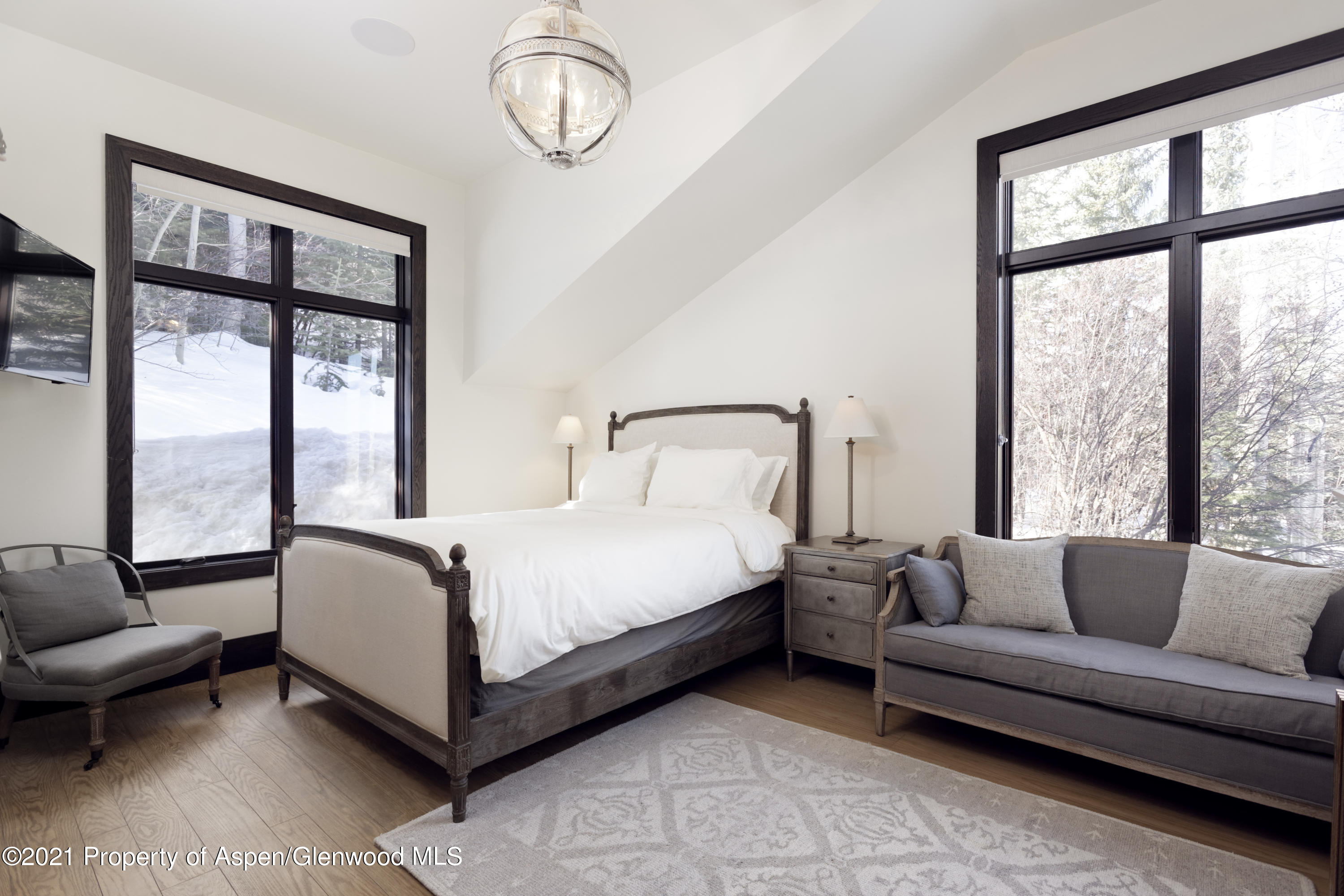 32 Elk Ridge Lane Snowmass Village, CO 81615 - Photo 15 of 34 a bedroom with a bed couch and window
