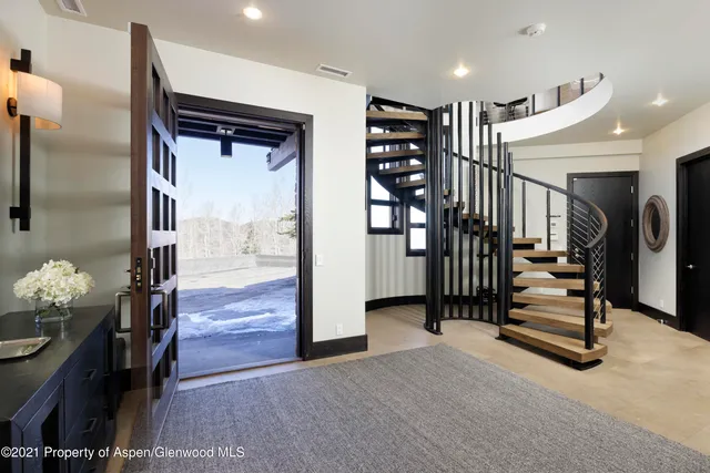 a view of entryway with livingroom and stairs