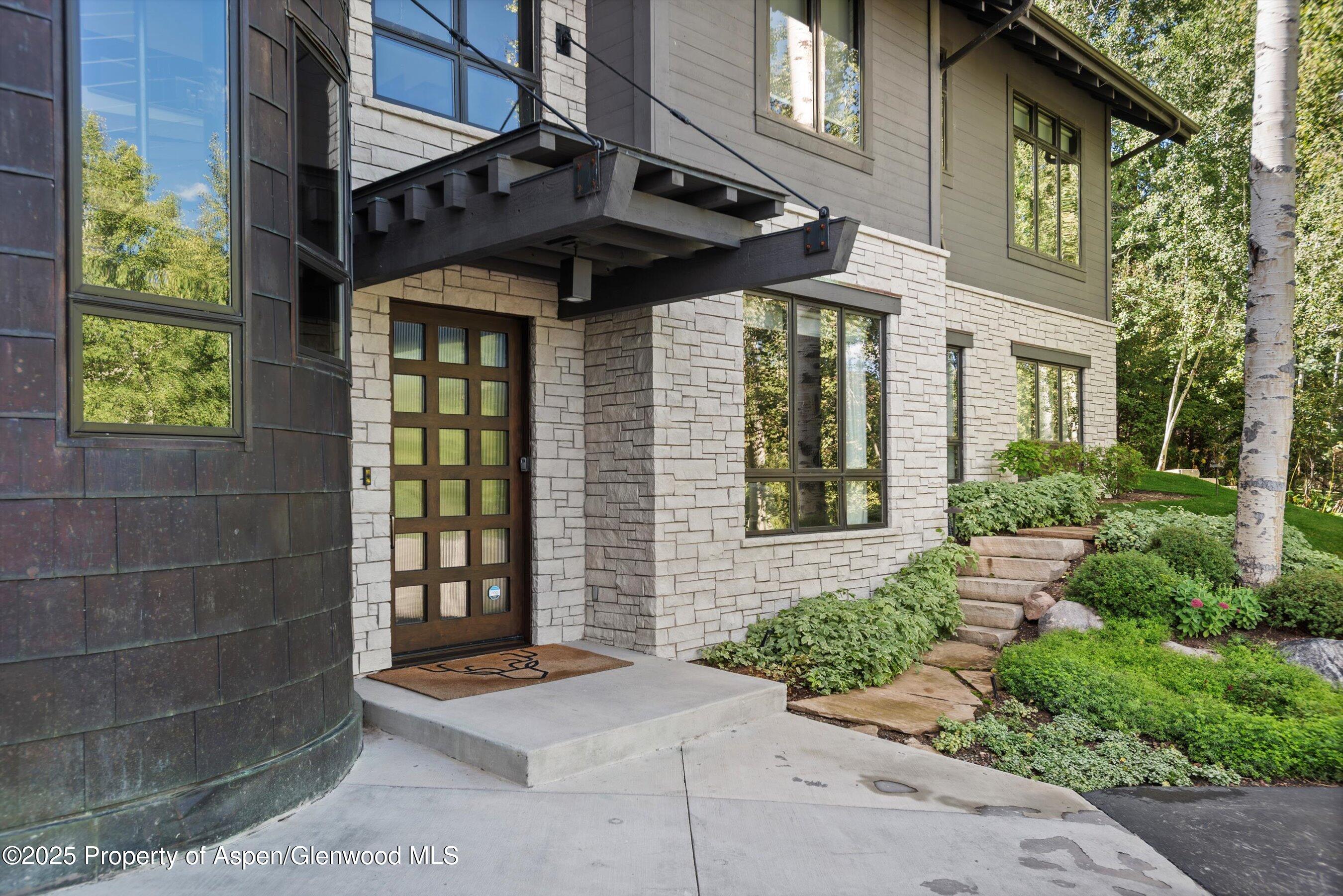 32 Elk Ridge Lane Snowmass Village, CO 81615 - Photo 25 of 34 a front view of a house