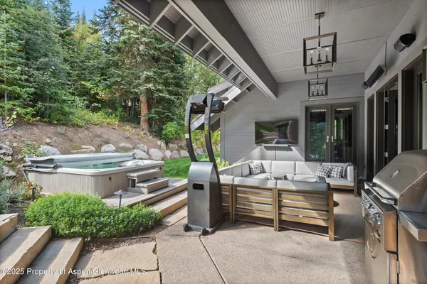 a view of a chairs and table in the patio