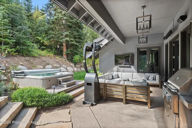 a view of a chairs and table in the patio