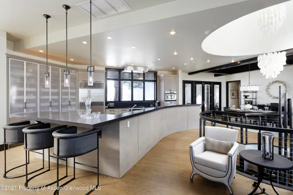 a kitchen with stainless steel appliances kitchen island granite countertop a sink and cabinets