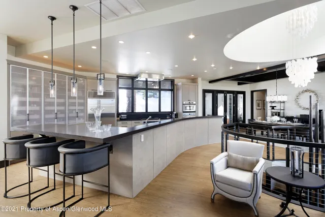 a kitchen with stainless steel appliances kitchen island granite countertop a sink and cabinets