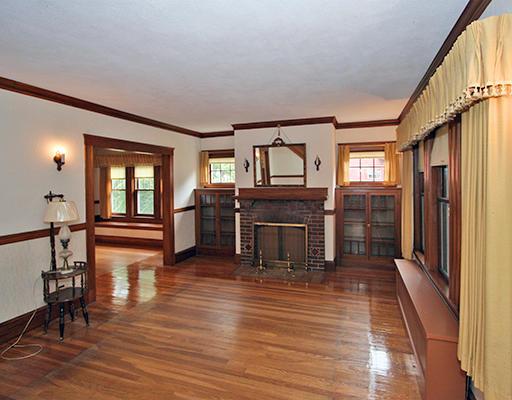 91 Valentine Road Arlington, MA 02476 - Photo 2 of 23 a living room with fireplace furniture and a wooden floor