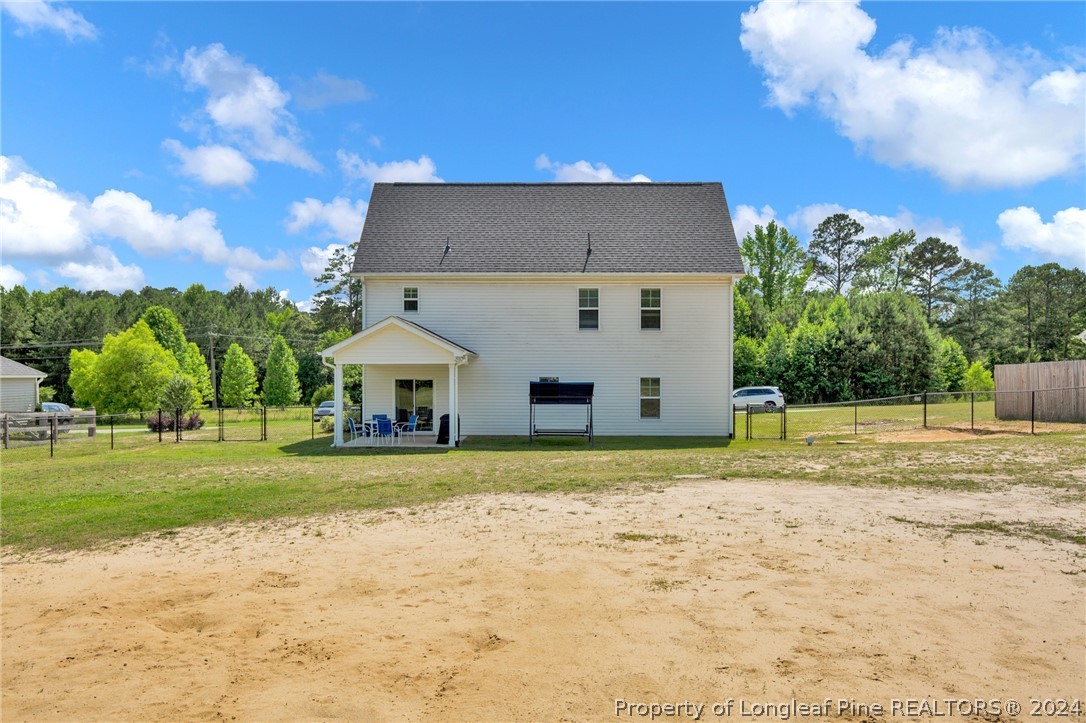 9670 East Reeves Bridge Road Linden, NC 28356 - Photo 2 of 35 a view of a house with a yard