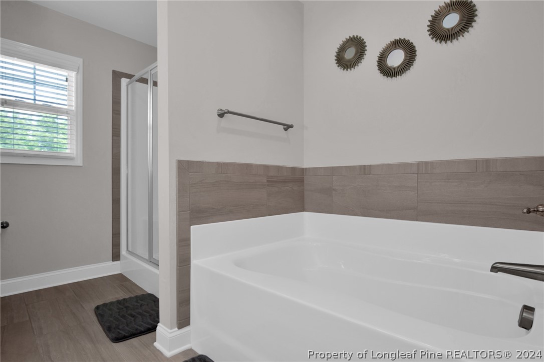 9670 East Reeves Bridge Road Linden, NC 28356 - Photo 21 of 35 a bathroom with a bathtub