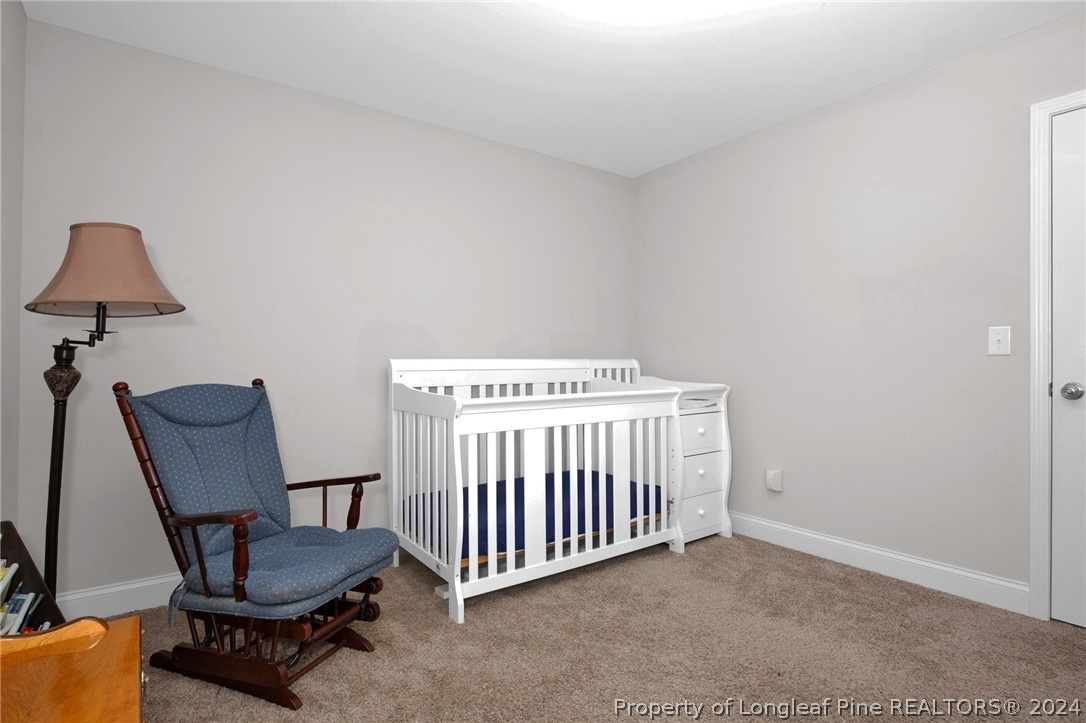 9670 East Reeves Bridge Road Linden, NC 28356 - Photo 25 of 35 a view of a room with furniture and a window