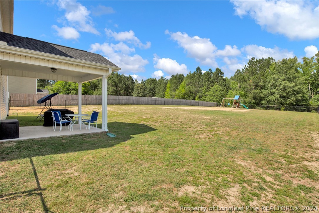 9670 East Reeves Bridge Road Linden, NC 28356 - Photo 30 of 35 a view of a swimming pool with a yard