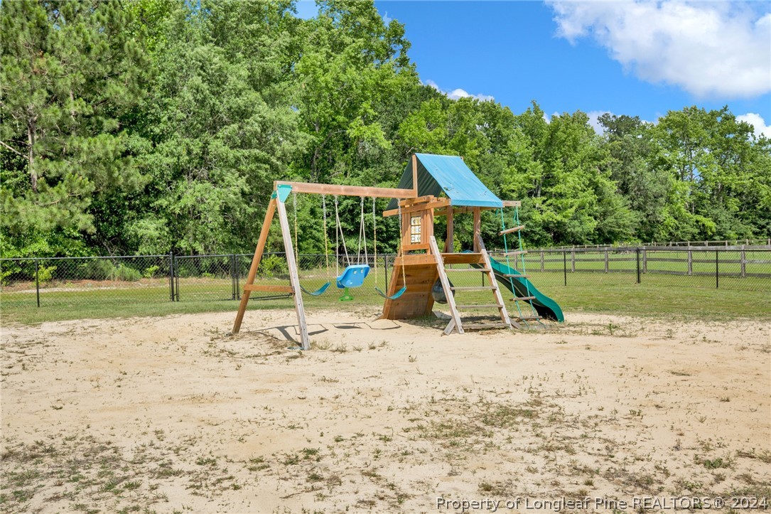 9670 East Reeves Bridge Road Linden, NC 28356 - Photo 33 of 35 a view of a park with a slide