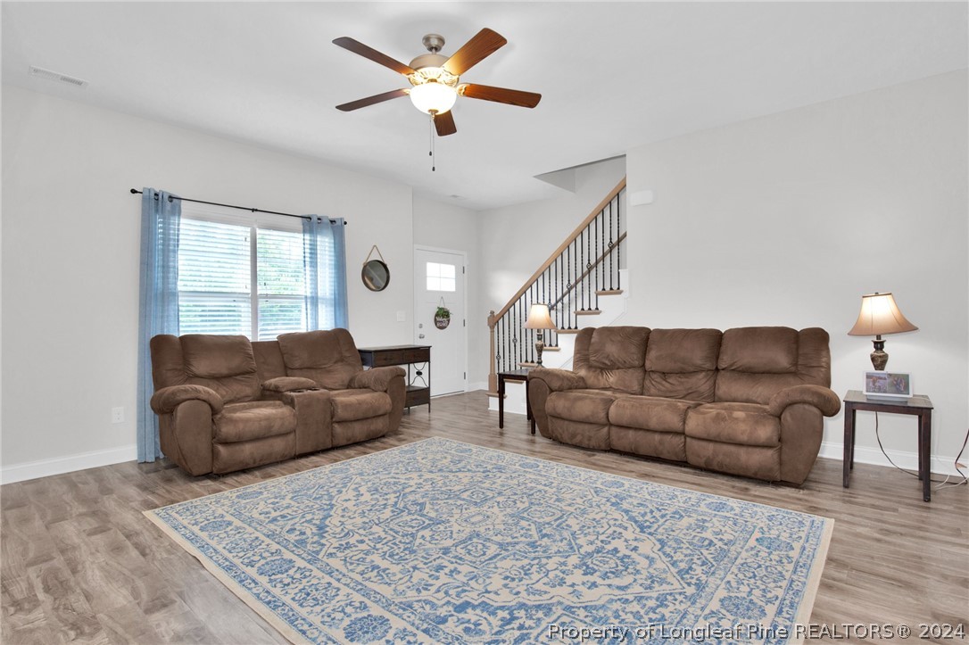 9670 East Reeves Bridge Road Linden, NC 28356 - Photo 4 of 35 a living room with furniture and a couch