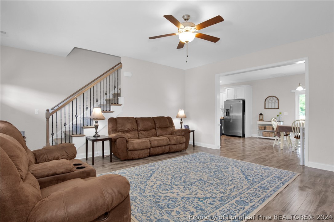 9670 East Reeves Bridge Road Linden, NC 28356 - Photo 7 of 35 a living room with furniture and a rug