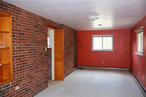 a view of an empty room with windows