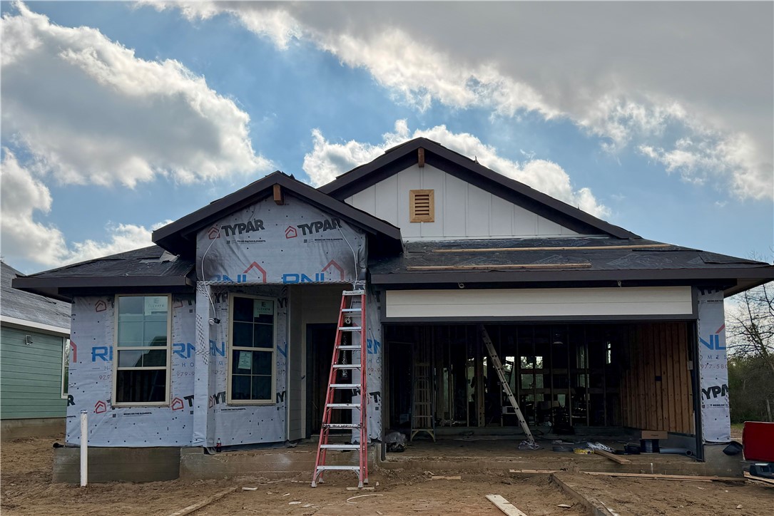View of front of property featuring board and batten siding