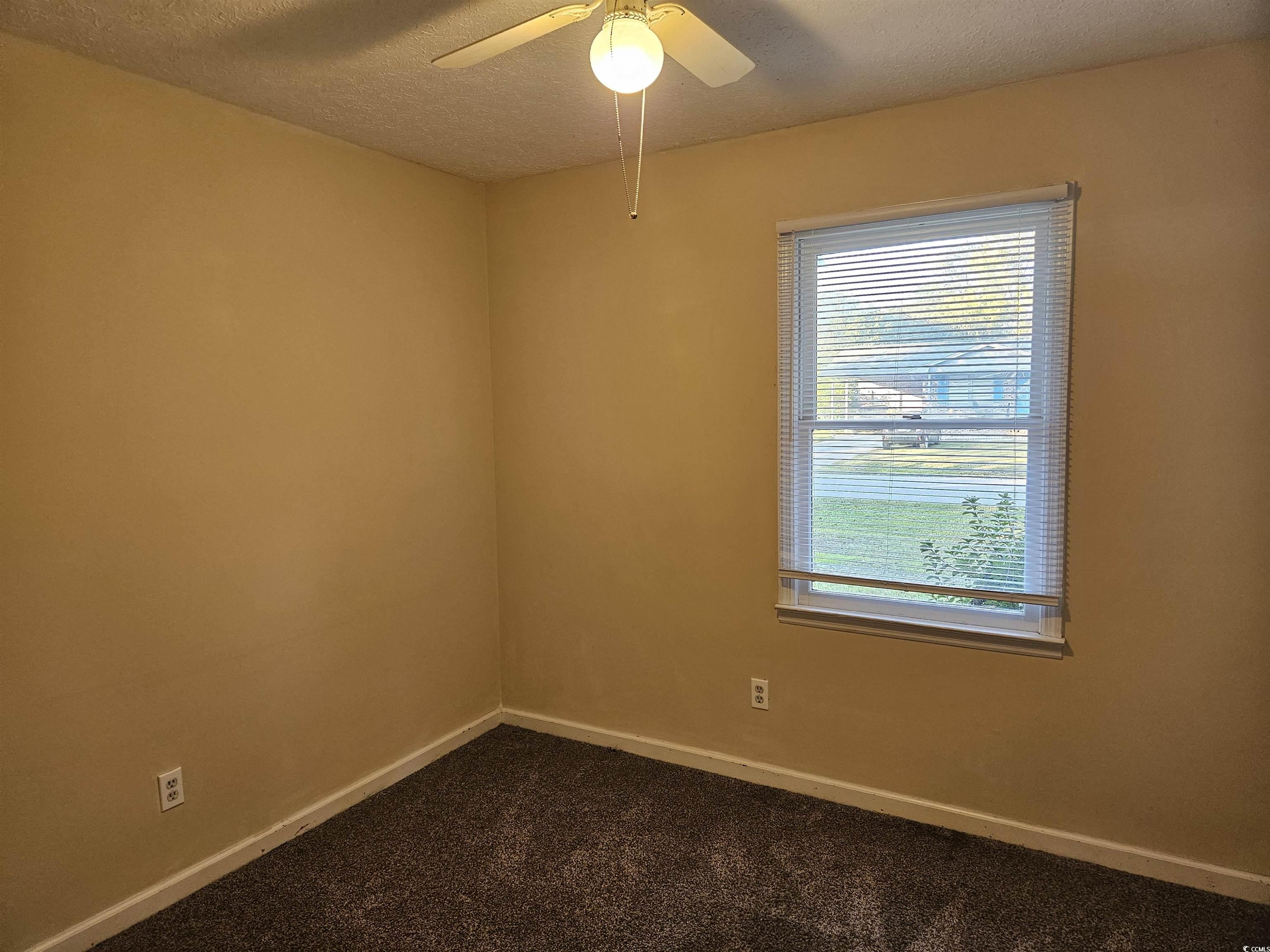 602 Jefferson Way Conway, SC 29526 - Photo 16 of 20 Spare room with a textured ceiling and dark colored carpet