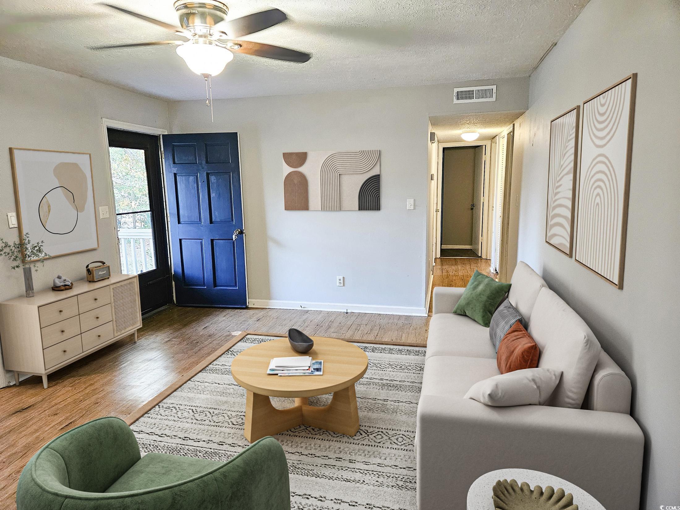 602 Jefferson Way Conway, SC 29526 - Photo 2 of 20 Living area with wood finished floors, a textured ceiling, and ceiling fan