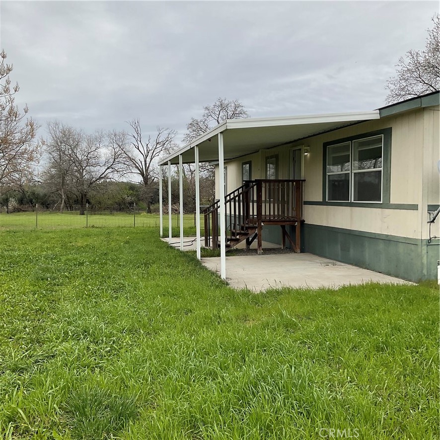 2804 Kirkwood Road Corning, CA 96021 - Photo 5 of 10 a view of a house with a yard and sitting area