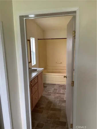 a bathroom with a shower and a sink