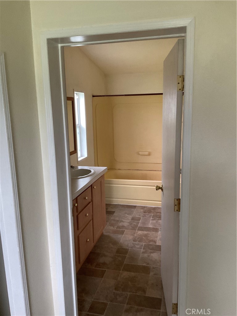 2804 Kirkwood Road Corning, CA 96021 - Photo 7 of 10 a bathroom with a shower and a sink