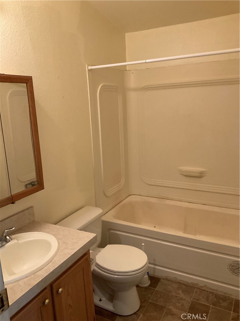 2804 Kirkwood Road Corning, CA 96021 - Photo 9 of 10 a bathroom with a sink a toilet and a mirror