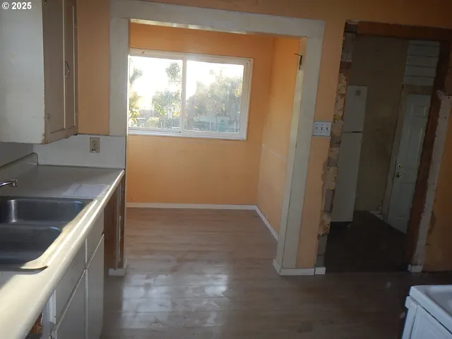 a kitchen with a sink stove and refrigerator