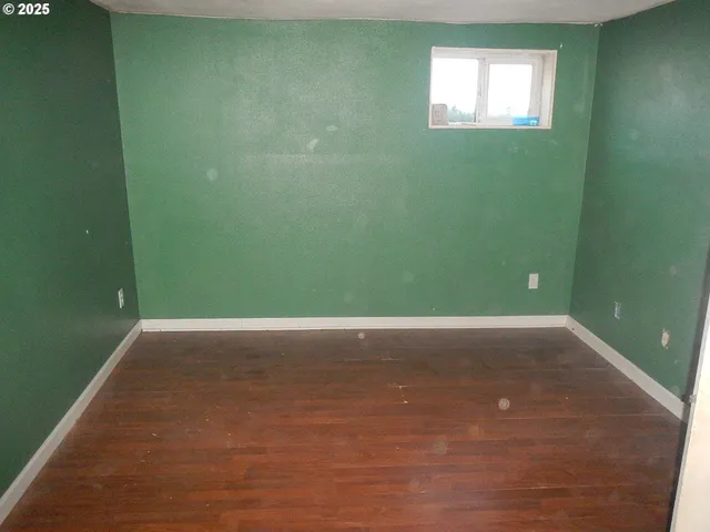 a backyard of a house with barbeque oven