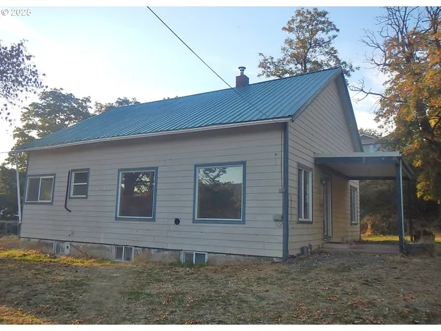 a front view of a house with garage