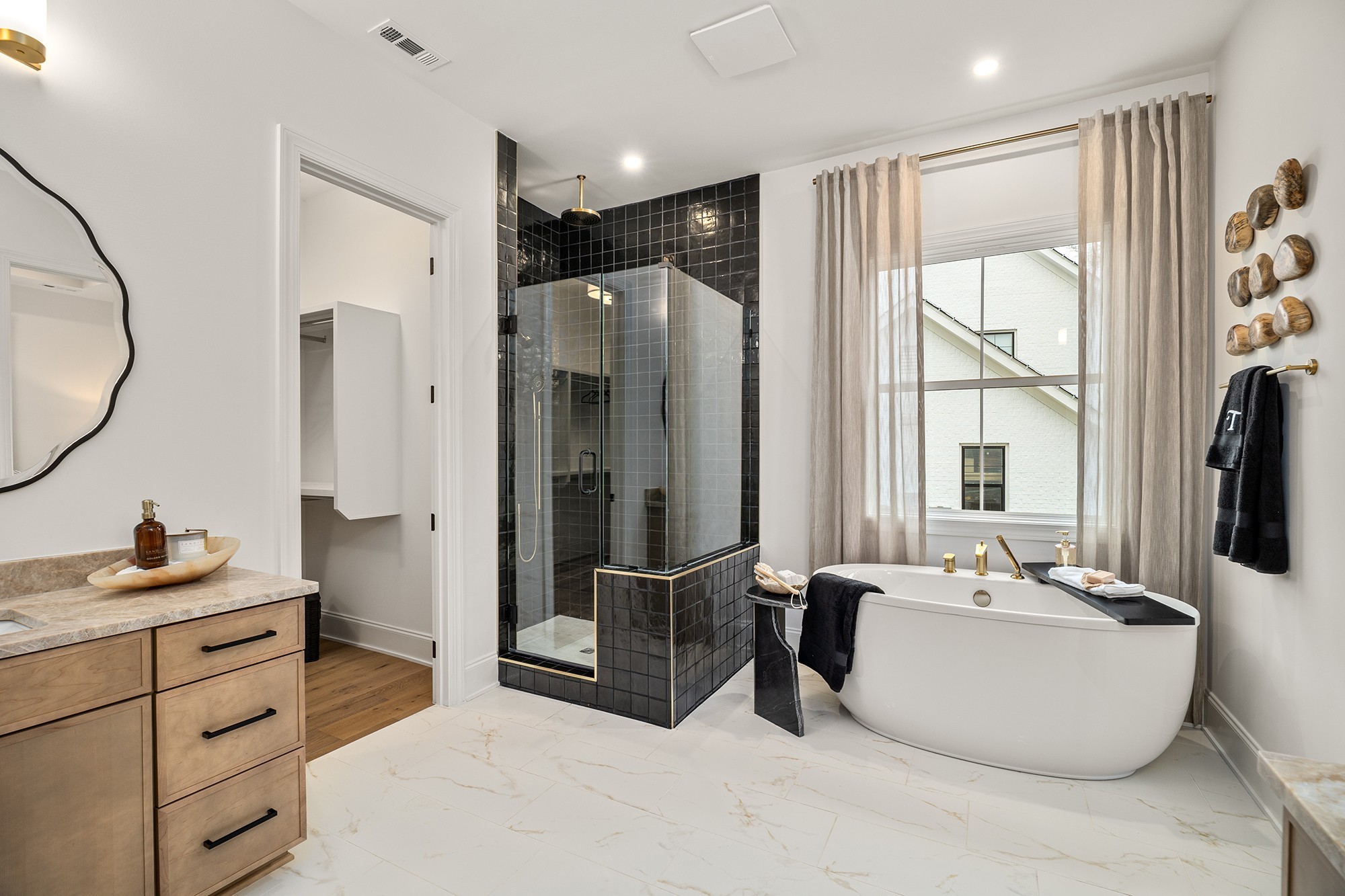 1412 Round Hill Lane Spring Hill, TN 37174 - Photo 26 of 36 a bathroom with a double vanity sink a mirror and a shower