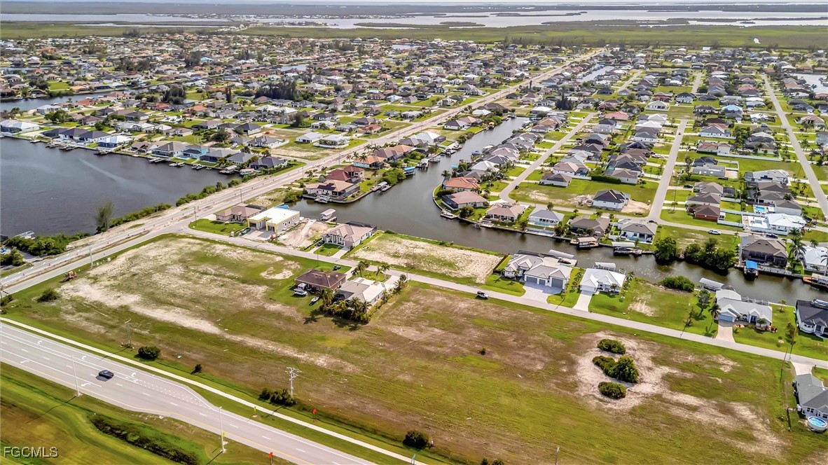100 Burnt Store Road Cape Coral, FL 33993 - Photo 1 of 21 an aerial view of residential houses with outdoor space